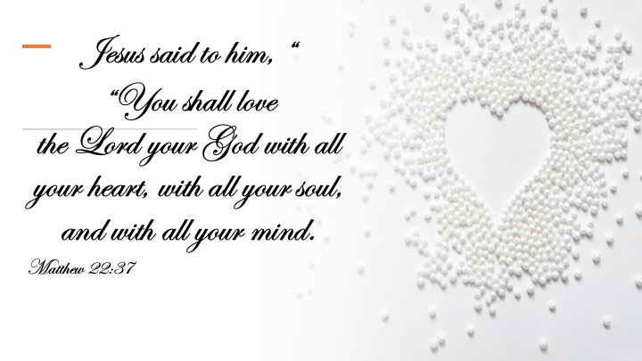 An artistic representation featuring white beads arranged to form a heart shape, accompanied by text quoting Matthew 22:37 about loving God with all one's heart, soul, and mind.